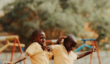 Children playing football in a Kampala schoolyard