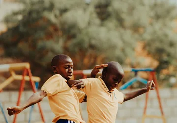 Children playing football in a Kampala schoolyard