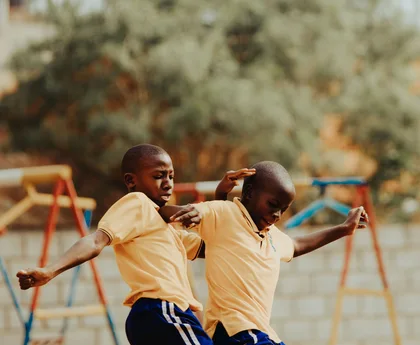 Children playing football in a Kampala schoolyard