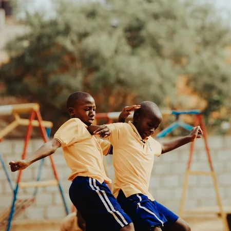 Children playing football in a Kampala schoolyard