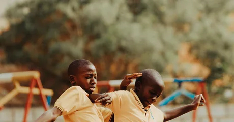 Children playing football in a Kampala schoolyard
