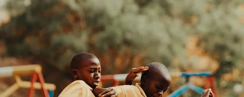 Children playing football in a Kampala schoolyard